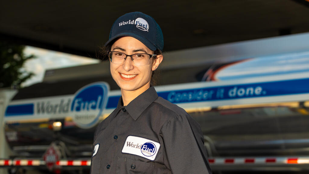 female truck driver in front of propane truck